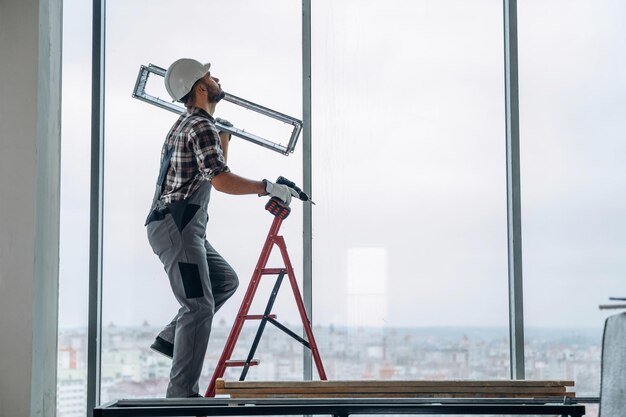 ladder-man-is-renovating-unfinished-room